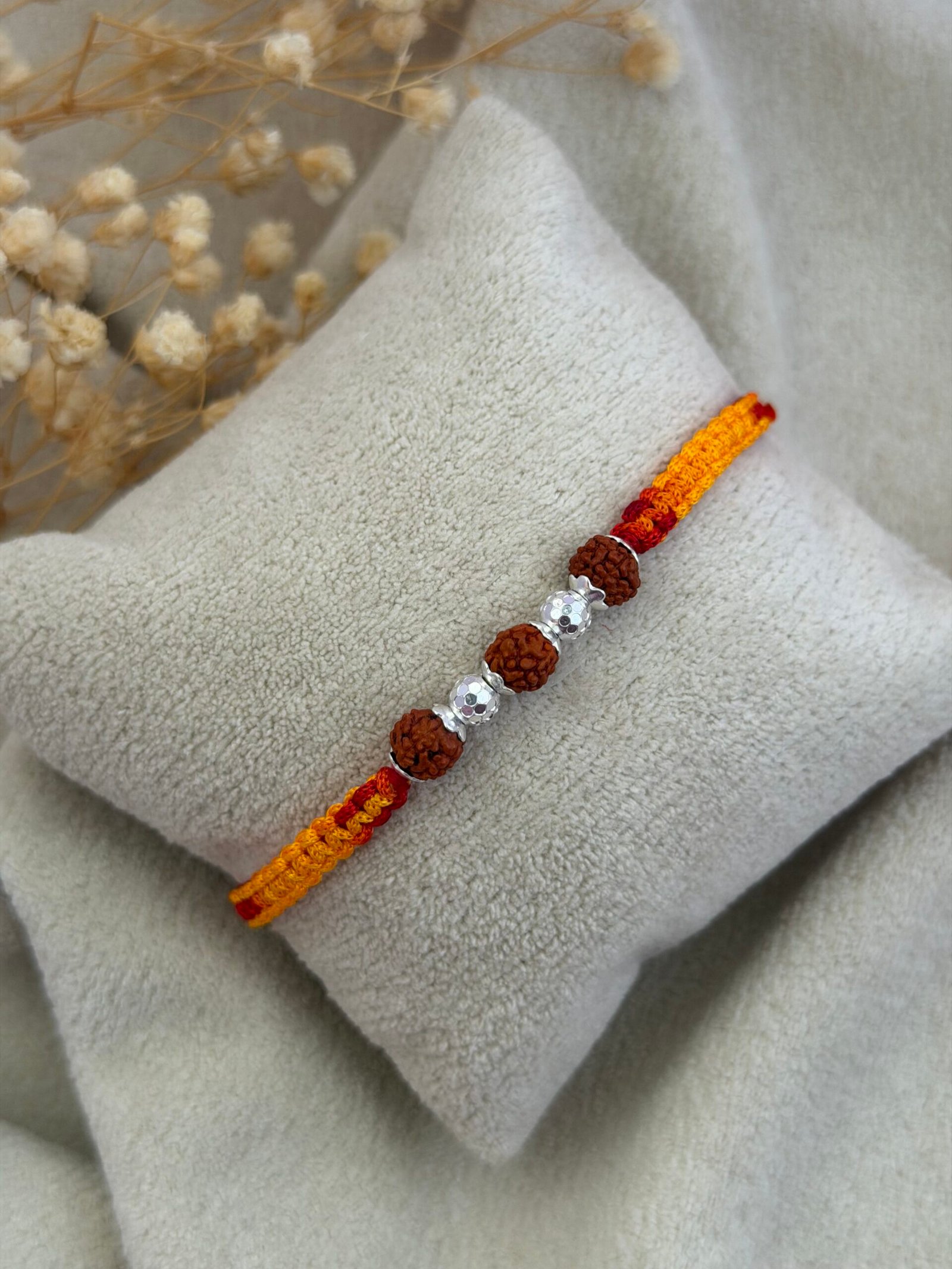 3 Rudraksha Rakhi with Diamond-Cut CNC Silver Bead red