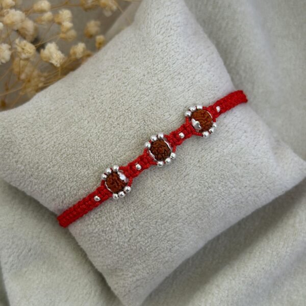Silver rudraksha floral rakhi red