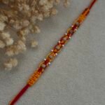 om more pankh silver rakhi