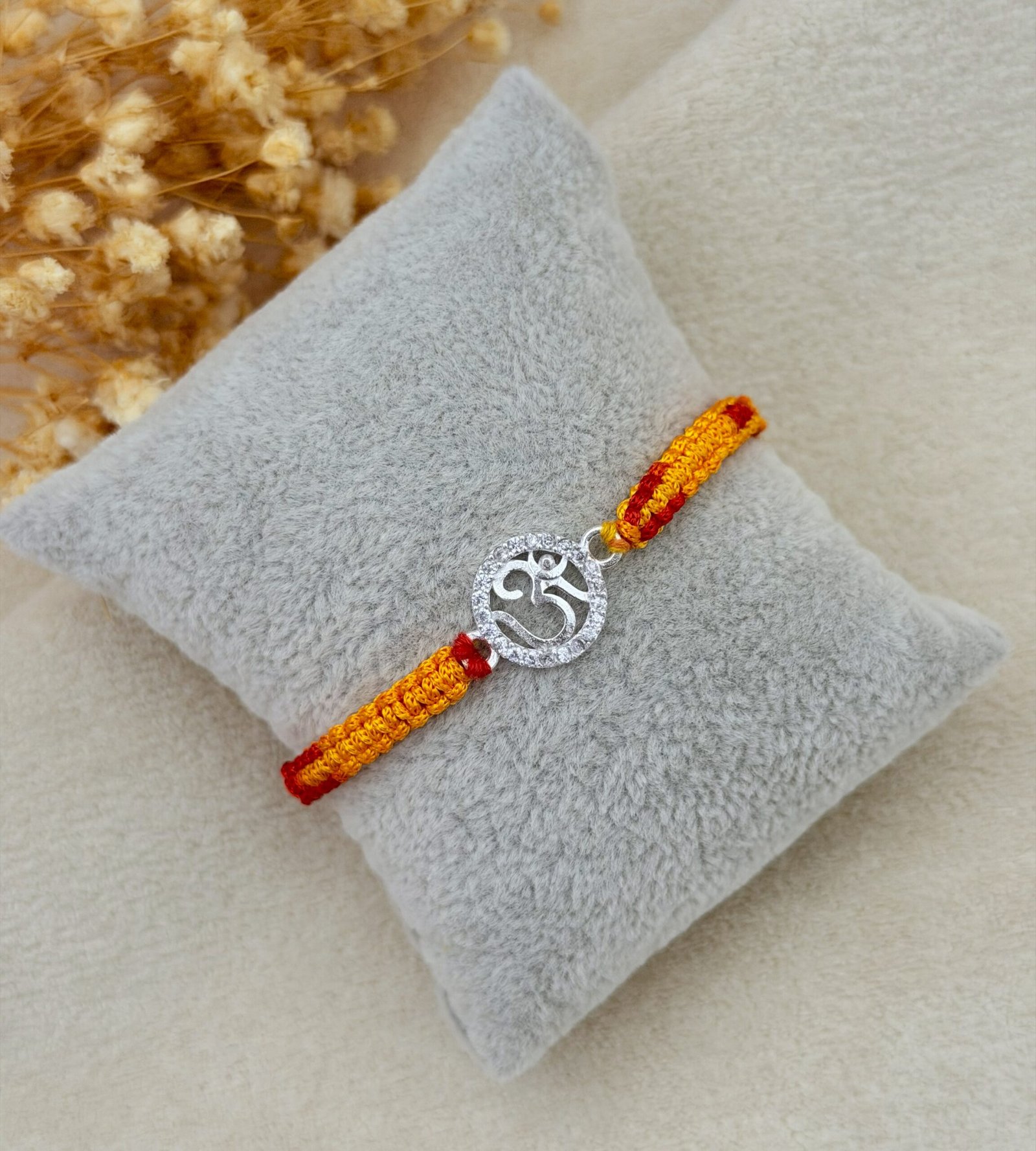 Om cz silver rakhi