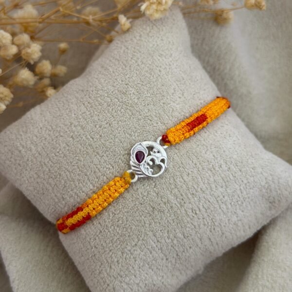 Om more pankh silver rakhi
