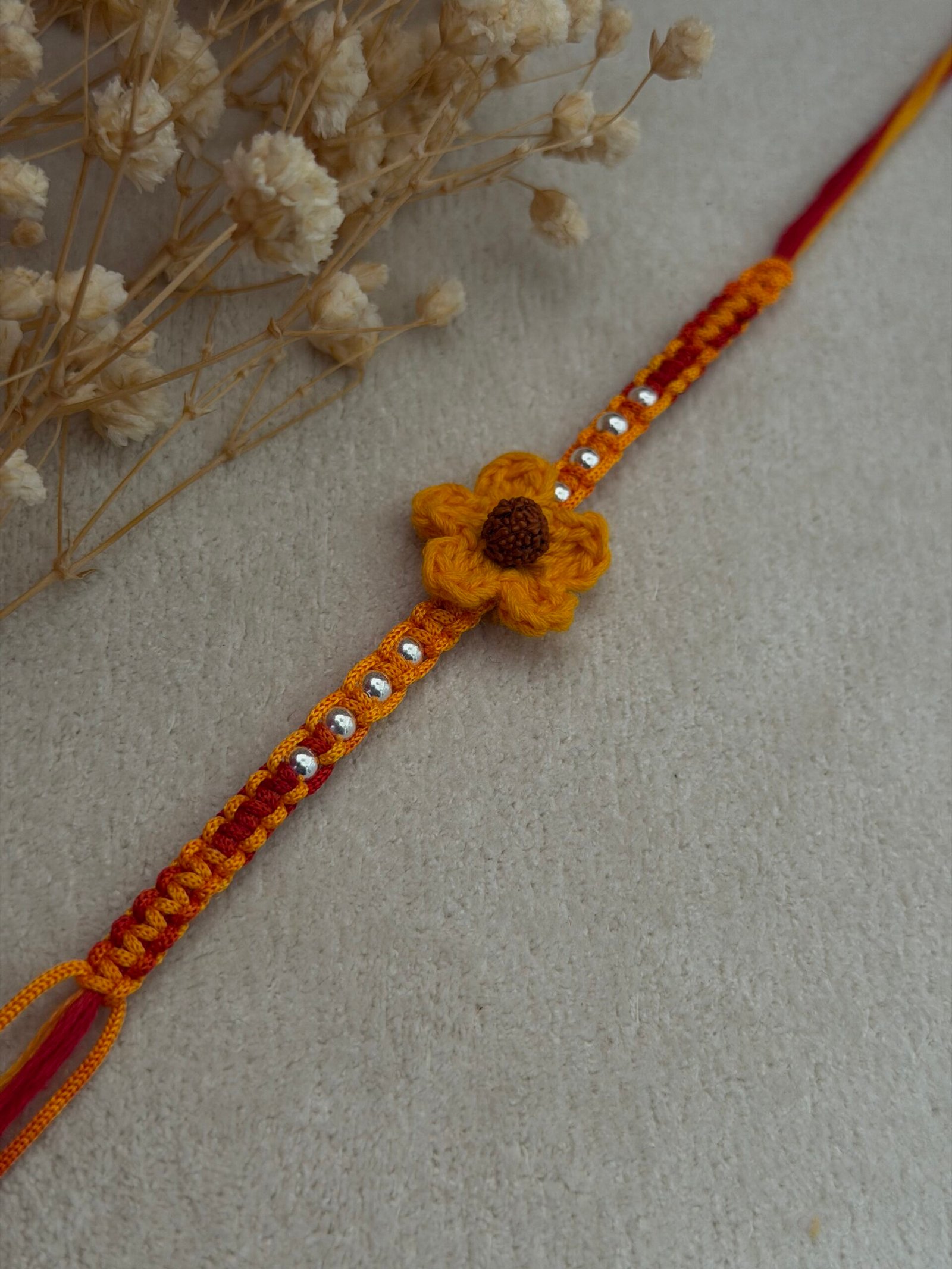 Rudraksha Crochet Flower Silver Rakhi - Image 2