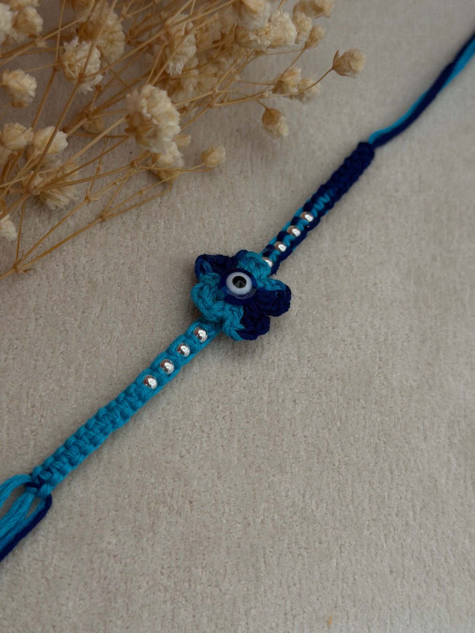 Evil eye Crochet Flower Silver Rakhi - Image 2