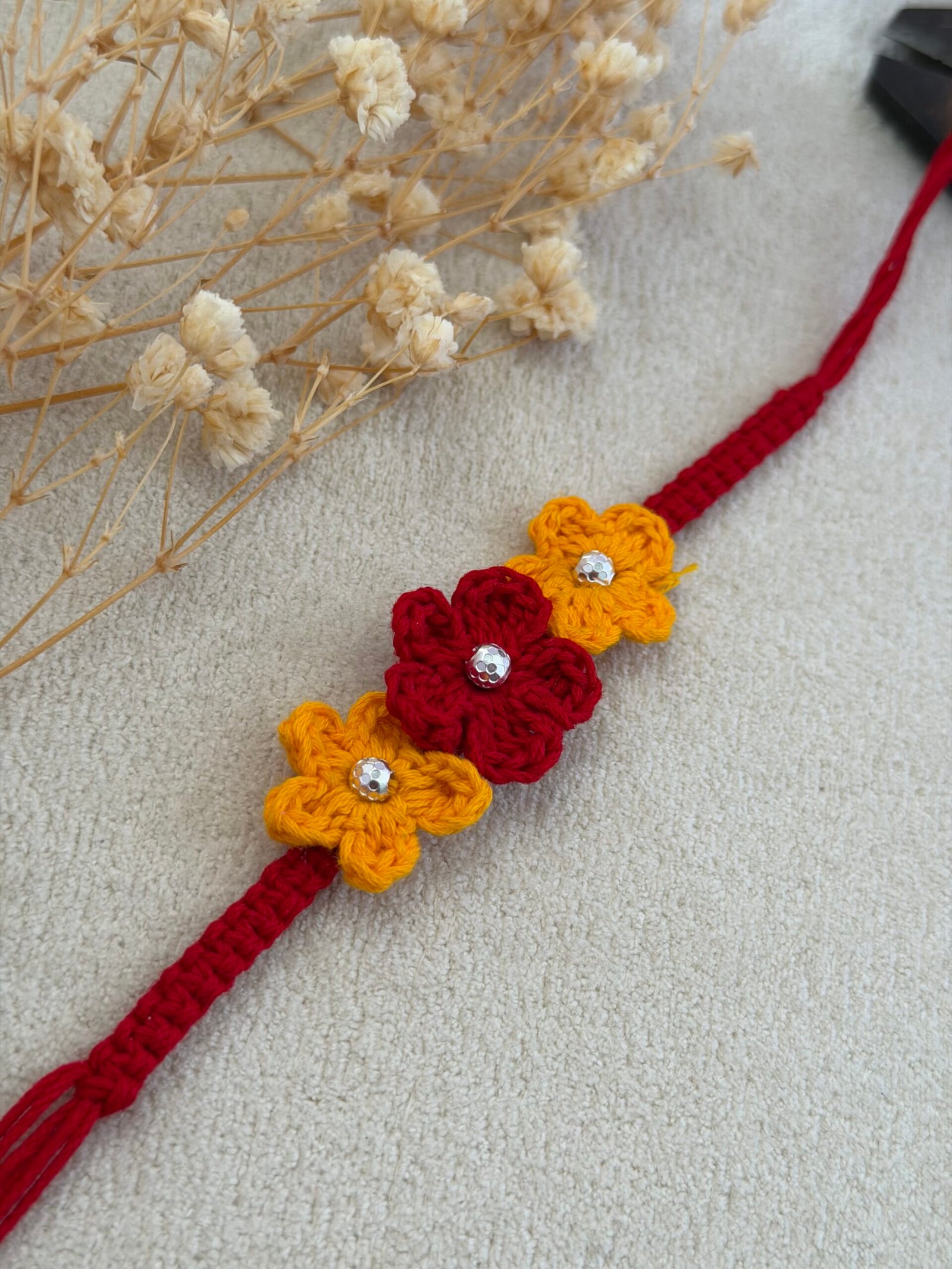 Red Yellow Crochet Flower Silver Rakhi - Image 2