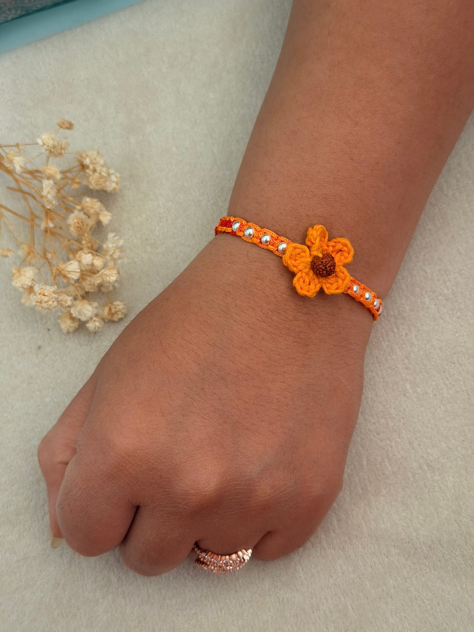 Rudraksha Crochet Flower Silver Rakhi - Image 4