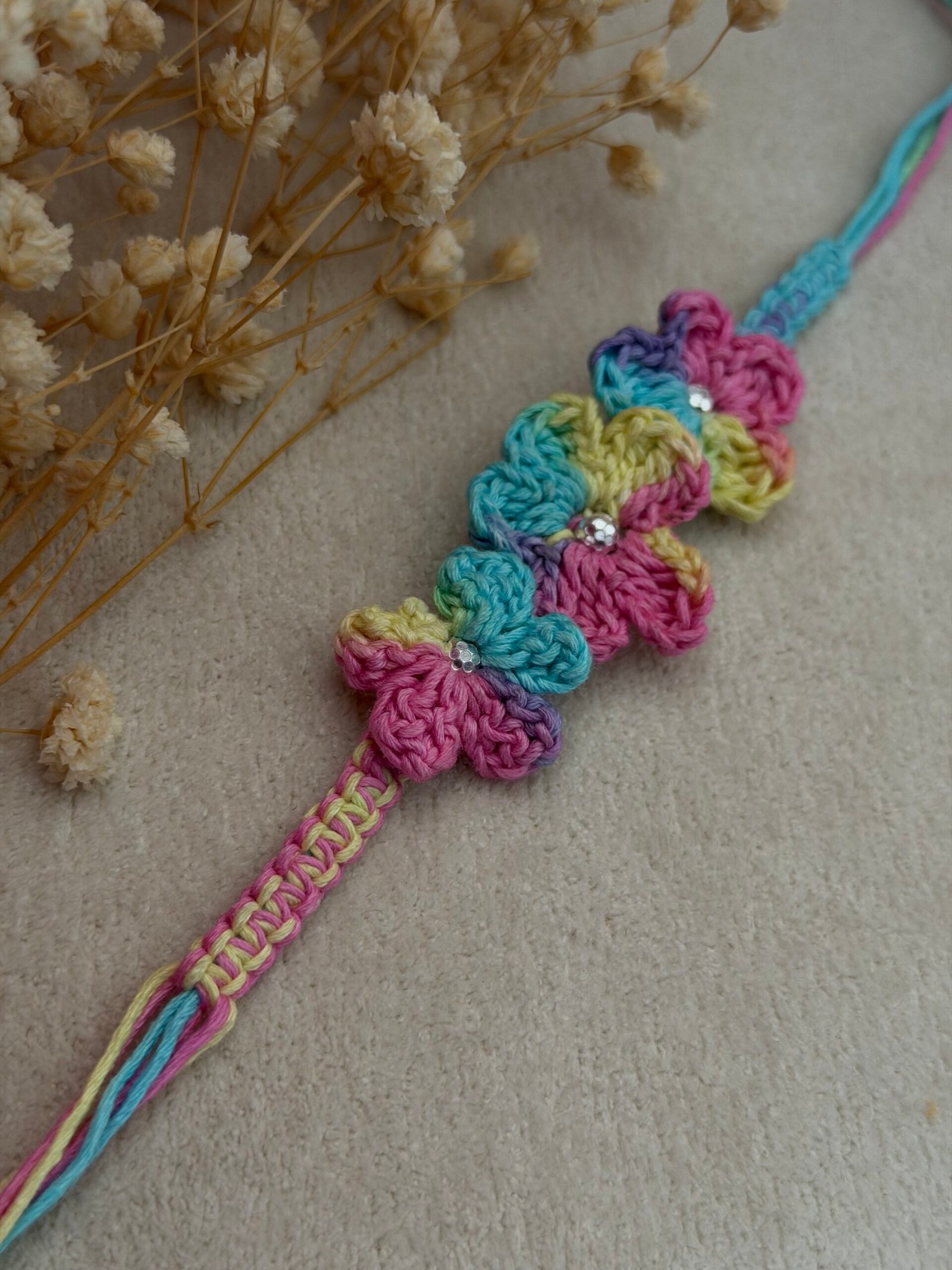 Pastel color Crochet Flower Silver Rakhi - Image 2